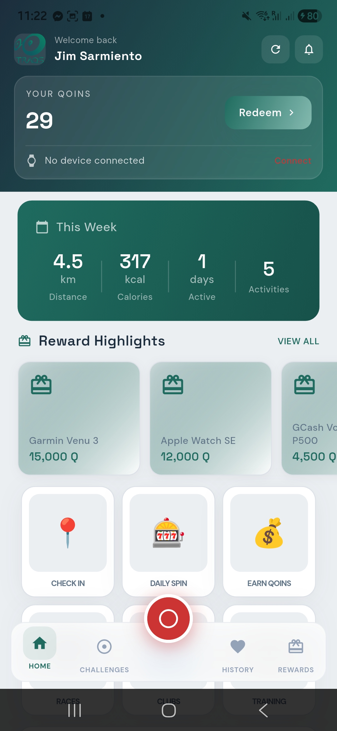 TRAQS app home screen showing Qoins balance, weekly stats, Check In, Daily Spin, and Earn Qoins features